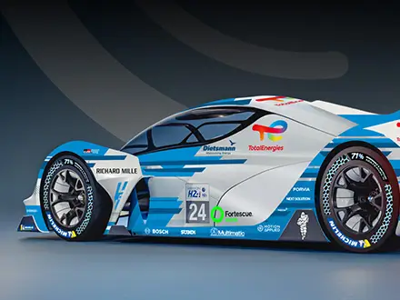 A sleek blue and white hydrogen-powered race car with aerodynamic design and sponsor logos is shown from the side on a glossy surface.