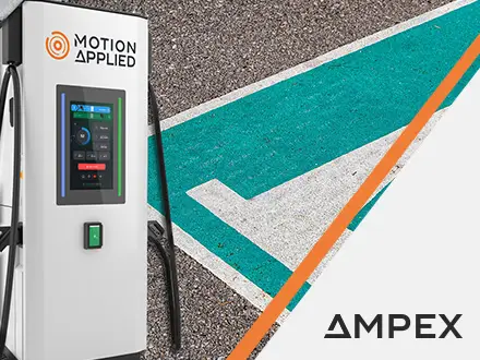 Close-up of an electric vehicle charging connector plugged into a station, with text overlay reading ‘Motion Applied launches AMPEX Ultra-Rapid EV Charging solutions to transform UK infrastructure.’ AMPEX logo appears in the bottom right corner.
