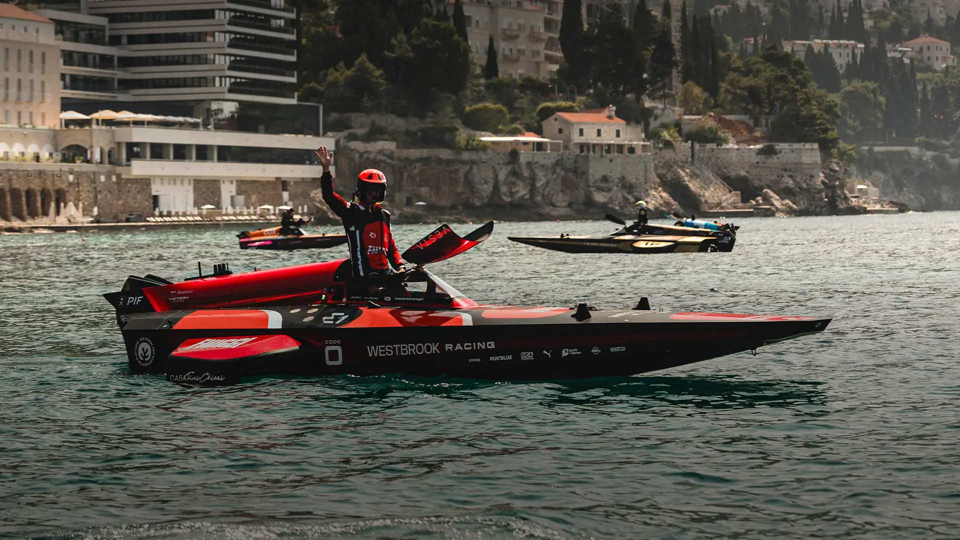 Man in a race boat on the water